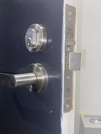 Deadbolt and lever handle fitted to a home front door